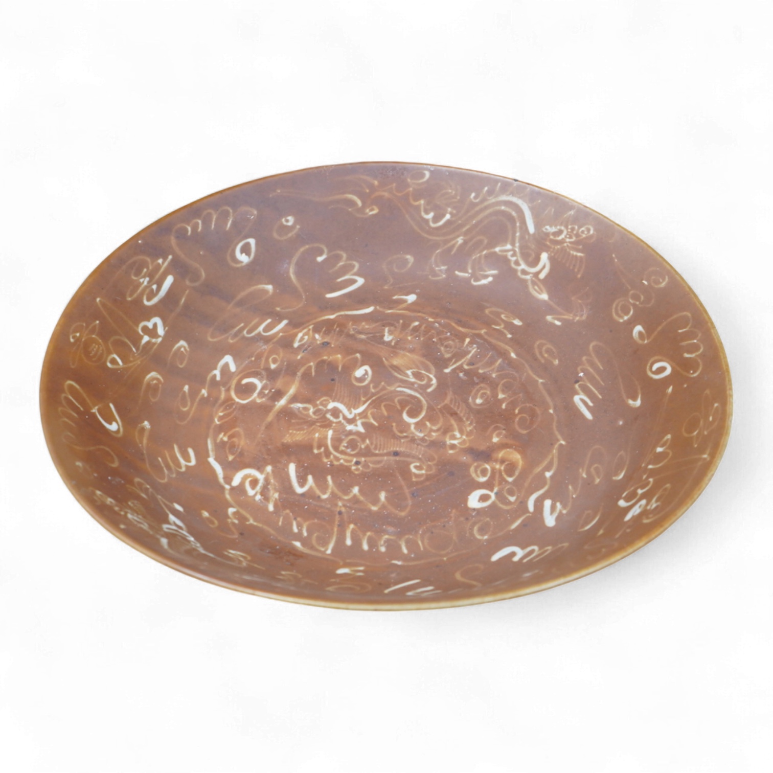 A Chinese late Ming iron brown glazed 'dragon & lion' dish, from a shipwreck, 35cm